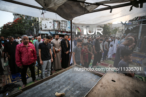 Palestinians are holding Eid al-Adha prayers in Bureij Refugee Camp in the central Gaza Strip, on June 16, 2024, amid the ongoing conflict b...