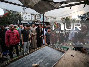 Palestinians are holding Eid al-Adha prayers in Bureij Refugee Camp in the central Gaza Strip, on June 16, 2024, amid the ongoing conflict b...