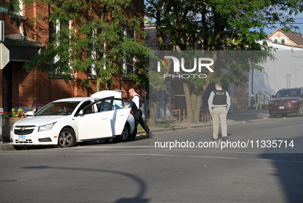 A 26-year-old male is being shot and killed on Father's Day while inside a vehicle in Chicago, Illinois, United States, on June 16, 2024. At...