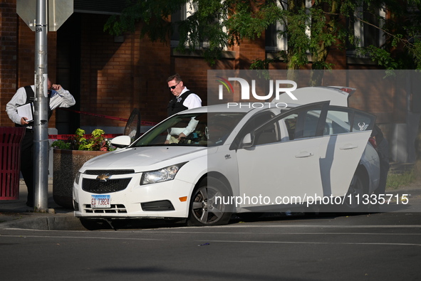 A 26-year-old male is being shot and killed on Father's Day while inside a vehicle in Chicago, Illinois, United States, on June 16, 2024. At...