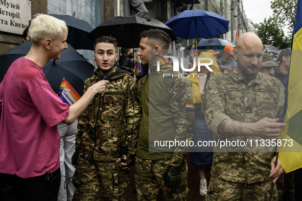 Ukrainian servicemen are taking part in the Equality March, organized by the LGBT+ community that is gathering for the first time since Russ...