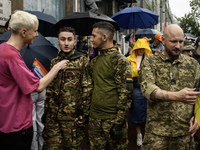 Ukrainian servicemen are taking part in the Equality March, organized by the LGBT+ community that is gathering for the first time since Russ...