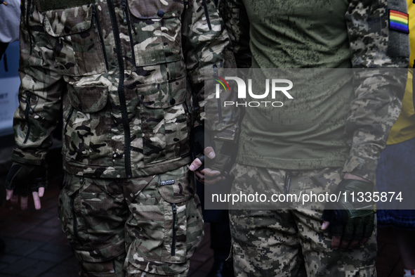 Ukrainian servicemen are taking part in the Equality March, organized by the LGBT+ community that is gathering for the first time since Russ...