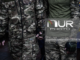 Ukrainian servicemen are taking part in the Equality March, organized by the LGBT+ community that is gathering for the first time since Russ...