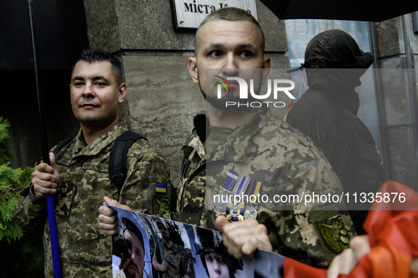 Ukrainian servicemen are taking part in the Equality March, organized by the LGBT+ community that is gathering for the first time since Russ...