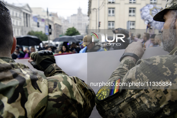 Ukrainian servicemen are taking part in the Equality March, organized by the LGBT+ community that is gathering for the first time since Russ...