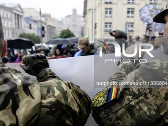 Ukrainian servicemen are taking part in the Equality March, organized by the LGBT+ community that is gathering for the first time since Russ...