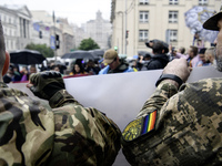 Ukrainian servicemen are taking part in the Equality March, organized by the LGBT+ community that is gathering for the first time since Russ...