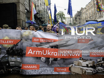 Participants are holding a banner, calling for air defense for Ukraine, at the Equality March, organized by the LGBT+ community that is gath...