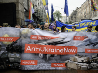 Participants are holding a banner, calling for air defense for Ukraine, at the Equality March, organized by the LGBT+ community that is gath...