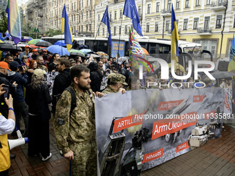 Ukrainian servicemen are taking part in the Equality March, organized by the LGBT+ community that is gathering for the first time since Russ...