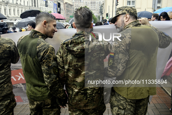 Ukrainian servicemen are taking part in the Equality March, organized by the LGBT+ community that is gathering for the first time since Russ...