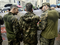 Ukrainian servicemen are taking part in the Equality March, organized by the LGBT+ community that is gathering for the first time since Russ...