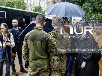 Ukrainian servicemen are taking part in the Equality March, organized by the LGBT+ community that is gathering for the first time since Russ...