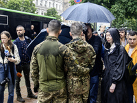 Ukrainian servicemen are taking part in the Equality March, organized by the LGBT+ community that is gathering for the first time since Russ...