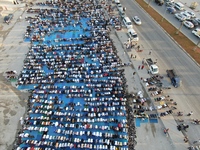 Muslims in Syria perform Eid al-Adha prayers in an open-air area in Bab al-Hawa Square, in the countryside of Idlib, northwest Syria, on the...