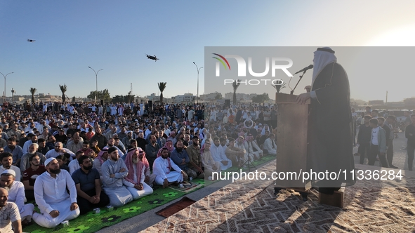 Muslims in Syria perform Eid al-Adha prayers in an open-air area in Bab al-Hawa Square, in the countryside of Idlib, northwest Syria, on the...