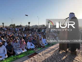 Muslims in Syria perform Eid al-Adha prayers in an open-air area in Bab al-Hawa Square, in the countryside of Idlib, northwest Syria, on the...