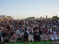 Muslims in Syria perform Eid al-Adha prayers in an open-air area in Bab al-Hawa Square, in the countryside of Idlib, northwest Syria, on the...