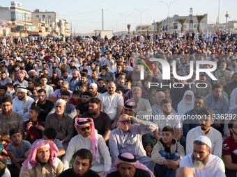 Muslims in Syria perform Eid al-Adha prayers in an open-air area in Bab al-Hawa Square, in the countryside of Idlib, northwest Syria, on the...