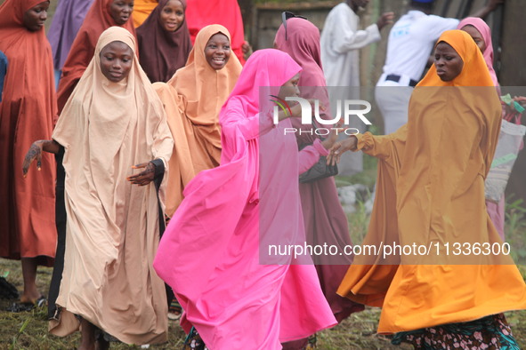 Female Muslims are showing excitement as Muslim faithful are praying to mark the Eid-El-Kabir festival in Ikeja, Lagos, Nigeria, on Sunday,...