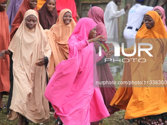 Female Muslims are showing excitement as Muslim faithful are praying to mark the Eid-El-Kabir festival in Ikeja, Lagos, Nigeria, on Sunday,...