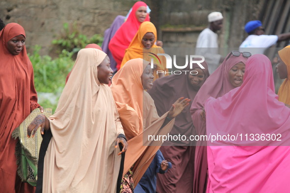 Female Muslims are showing excitement as Muslim faithful are praying to mark the Eid-El-Kabir festival in Ikeja, Lagos, Nigeria, on Sunday,...