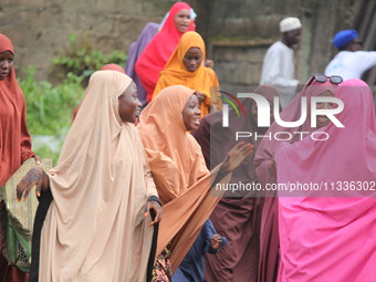 Female Muslims are showing excitement as Muslim faithful are praying to mark the Eid-El-Kabir festival in Ikeja, Lagos, Nigeria, on Sunday,...