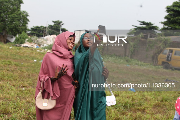 Female Muslims are taking a selfie with excitement as Muslim faithful are praying to mark the Eid-El-Kabir festival in Ikeja, Lagos, Nigeria...