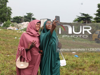 Female Muslims are taking a selfie with excitement as Muslim faithful are praying to mark the Eid-El-Kabir festival in Ikeja, Lagos, Nigeria...