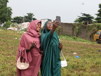 Female Muslims are taking a selfie with excitement as Muslim faithful are praying to mark the Eid-El-Kabir festival in Ikeja, Lagos, Nigeria...