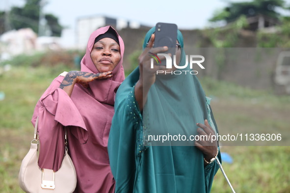 Female Muslims are taking a selfie with excitement as Muslim faithful are praying to mark the Eid-El-Kabir festival in Ikeja, Lagos, Nigeria...