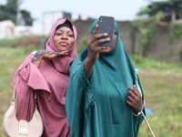 Female Muslims are taking a selfie with excitement as Muslim faithful are praying to mark the Eid-El-Kabir festival in Ikeja, Lagos, Nigeria...