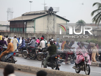 Commercial motorcyclists are awaiting passengers as Muslim faithful are praying to mark the Eid-El-Kabir festival in Ikeja, Lagos, Nigeria,...