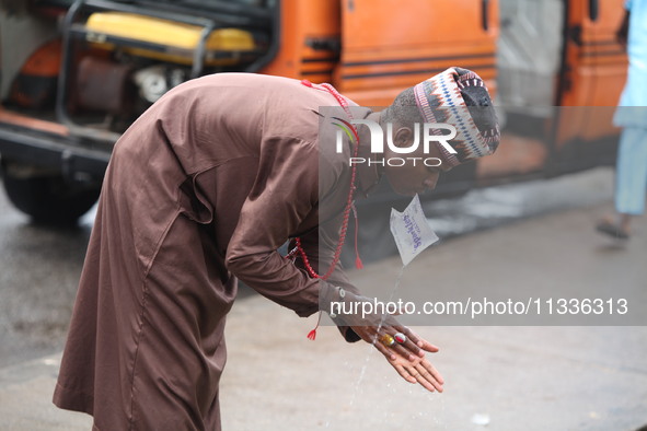 A Muslim faithful is washing his hands as Muslim faithful are praying to mark the Eid-El-Kabir festival in Ikeja, Lagos, Nigeria, on Sunday,...