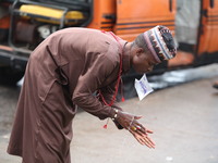 A Muslim faithful is washing his hands as Muslim faithful are praying to mark the Eid-El-Kabir festival in Ikeja, Lagos, Nigeria, on Sunday,...