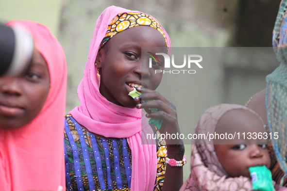 A Muslim faithful is taking yogurt with excitement as Muslim faithful are praying to mark the Eid-El-Kabir festival in Ikeja, Lagos, Nigeria...