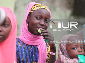 A Muslim faithful is taking yogurt with excitement as Muslim faithful are praying to mark the Eid-El-Kabir festival in Ikeja, Lagos, Nigeria...