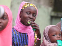 A Muslim faithful is taking yogurt with excitement as Muslim faithful are praying to mark the Eid-El-Kabir festival in Ikeja, Lagos, Nigeria...