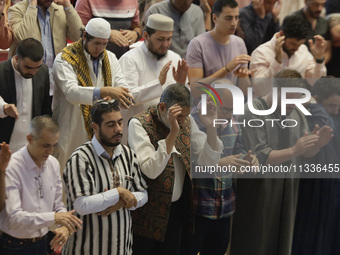 Members of the Muslim community in Mexico City, Mexico, are praying inside the facilities of the Plan Sexenal on the occasion of the celebra...