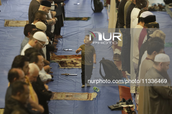 In the center, a child from the Muslim community in Mexico City, Mexico, on the occasion of the celebration of Eid al-Adha (Feast of Sacrifi...