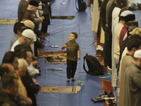 In the center, a child from the Muslim community in Mexico City, Mexico, on the occasion of the celebration of Eid al-Adha (Feast of Sacrifi...