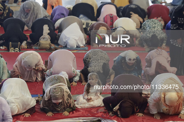 A girl from the Muslim community in Mexico City, Mexico, is praying inside the Plan Sexenal facilities on the occasion of the celebration of...