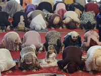 A girl from the Muslim community in Mexico City, Mexico, is praying inside the Plan Sexenal facilities on the occasion of the celebration of...