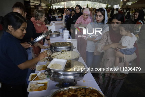 Members of the Muslim community in Mexico City, Mexico, on Eid al-Adha, are breaking their fast inside the facilities of the Plan Sexenal to...