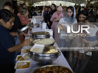 Members of the Muslim community in Mexico City, Mexico, on Eid al-Adha, are breaking their fast inside the facilities of the Plan Sexenal to...