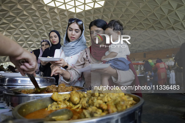 Members of the Muslim community in Mexico City, Mexico, on Eid al-Adha, are breaking their fast inside the facilities of the Plan Sexenal to...