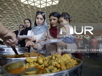 Members of the Muslim community in Mexico City, Mexico, on Eid al-Adha, are breaking their fast inside the facilities of the Plan Sexenal to...