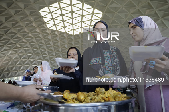 Members of the Muslim community in Mexico City, Mexico, on Eid al-Adha, are breaking their fast inside the facilities of the Plan Sexenal to...