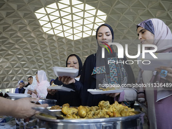 Members of the Muslim community in Mexico City, Mexico, on Eid al-Adha, are breaking their fast inside the facilities of the Plan Sexenal to...